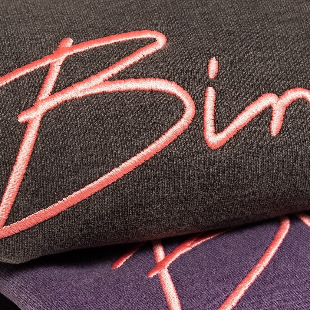 Two folded sweatshirts with 'Bimini' branding in pink on a white background