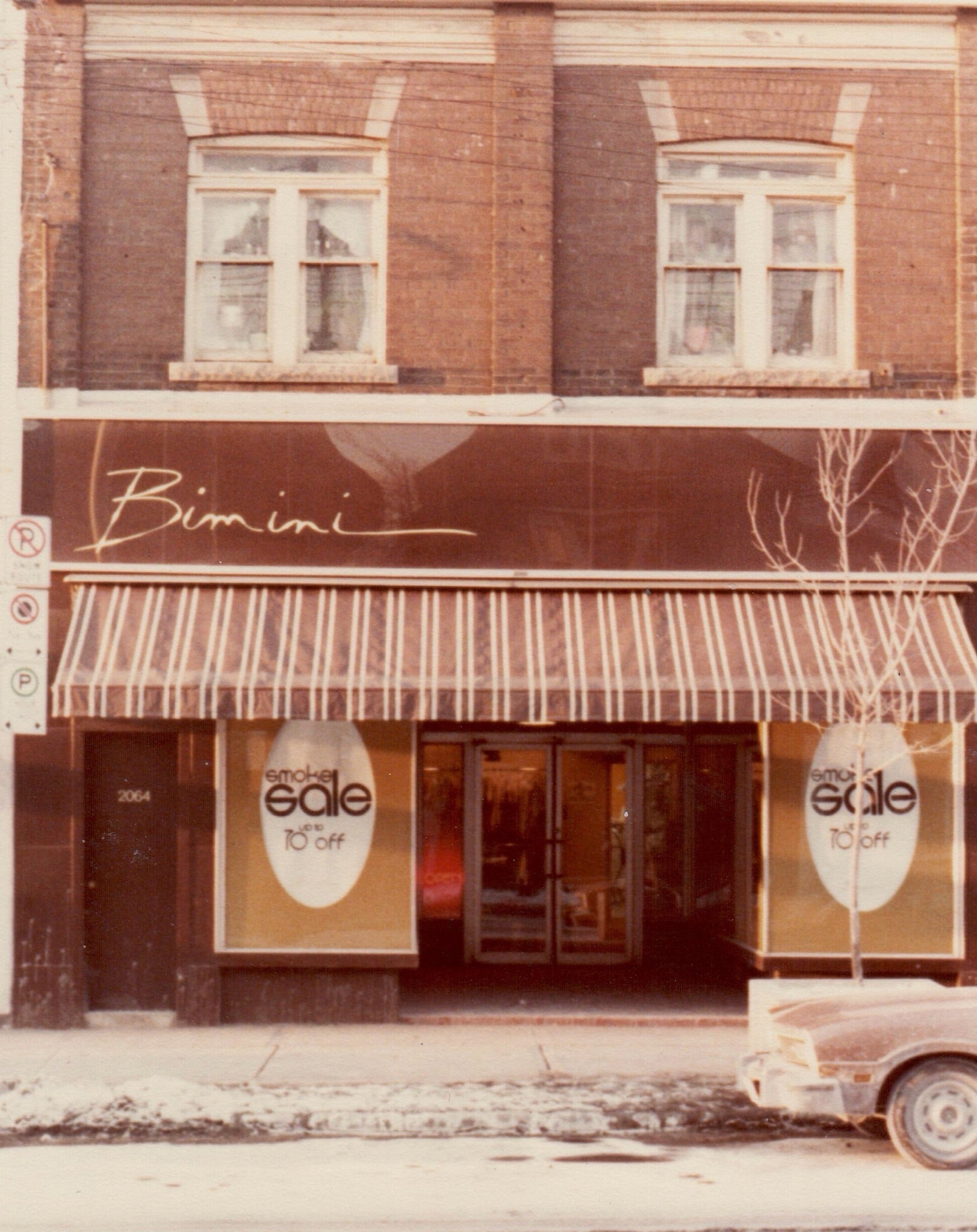 Bimini original storefront with sale signs in the windows